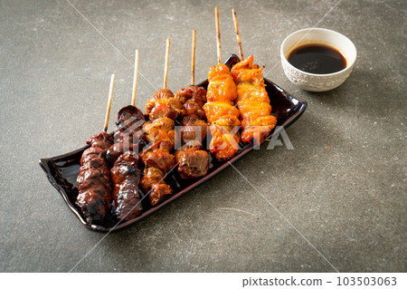 Japanese chicken grill or yakitori serve in izakaya style Japanese chicken grill or yakitori serve in izakaya style 103503063