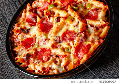 Pizza Casserole of pasta, beef, pepperoni, cheese 103506992