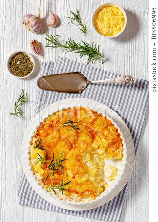 cheesy potato bake or potato casserole, top view cheesy potato bake or potato casserole, top view 103506993