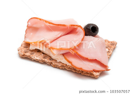 Whole Grain Crispbread with Ham, Cream Cheese and Olives - Isolated 103507057