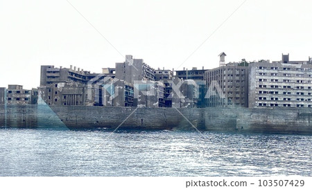 Gunkanjima is a small island located about 20 kilometers from Nagasaki Port. Until 1974, the island served as a coal mine, and more than 5000 residents called the 480 meter long, 150 meter wide island Gunkanjima is a small island located about 20 kilometers from Nagasaki Port. Until 1974, the island served as a coal mine, and more than 5000 residents called the 480 meter long, 150 meter wide island 103507429