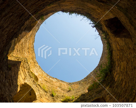View of the blue sky from the well of the tower 103507871