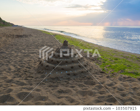 Built House sand castle with tower on the shore of the beach Built House sand castle with tower on the shore of the beach 103507915