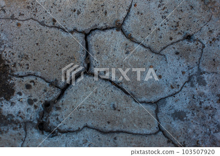 Dark gray background with cracks and hollows 103507920
