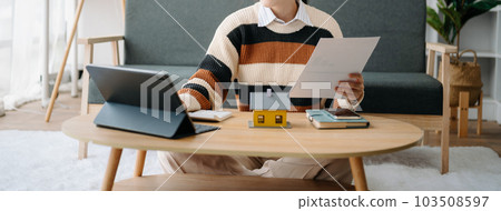 Real estate broker agent presenting and consult to customer to decision making sign insurance form agreement, home model, concerning mortgage loan offer in office Real estate broker agent presenting and consult to customer to decision making sign insurance form agreement, home model, concerning mortgage loan offer in office 103508597