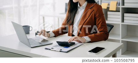 Businesswoman hand using smart phone laptop and tablet with social network diagram on desk as concept Businesswoman hand using smart phone laptop and tablet with social network diagram on desk as concept 103508795