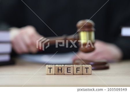 Text Theft and female judge knocking gavel at courtyard Text Theft and female judge knocking gavel at courtyard 103509349