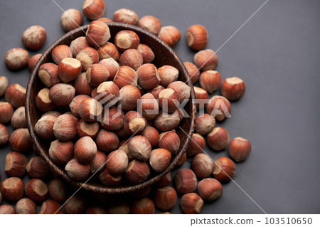 Whole hazelnuts nuts with shell close-up studio shot 103510650