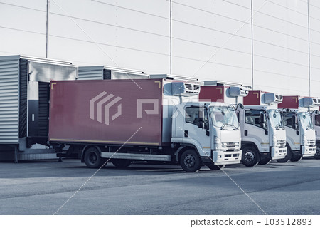 Freight trucks stand by the doors. 103512893