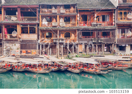 Ancient wooden house by the river. Fenghuang. 103513159