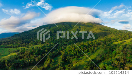 Amazing view of beautiful Arenal volcano in Costa Rica. Panorama of volcano Arenal reflected on wonderful picturesque lake, La Fortuna, Costa Rica. Central America. Amazing view of beautiful Arenal volcano in Costa Rica. Panorama of volcano Arenal reflected on wonderful picturesque lake, La Fortuna, Costa Rica. Central America. 103514214