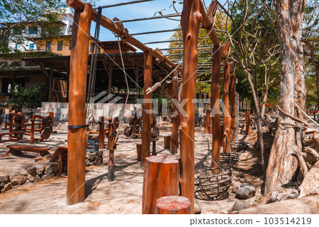 Close up outdoors gym equipment at the park sports ground. Different machines for training, activity at workout space. outdoor sports ground in morning at dawn 103514219
