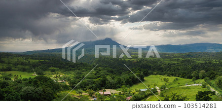 Amazing view of beautiful Arenal volcano in Costa Rica. Panorama of volcano Arenal reflected on wonderful picturesque lake, La Fortuna, Costa Rica. Central America. 103514281