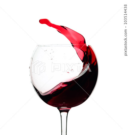 Splash of red wine in a glass isolated on  white. 103514438