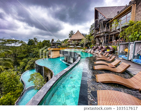 Jungle pool and bar overlooking rice terraces in Ubud, Bali, Indonesia Jungle pool and bar overlooking rice terraces in Ubud, Bali, Indonesia 103517617