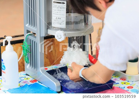 Male hand making shaved ice Male hand making shaved ice 103519559