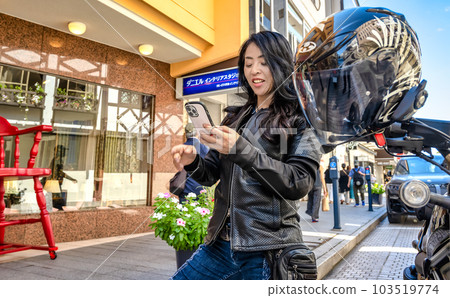 A female rider touring Yokohama on a large cruiser bike Shopping at Yokohama Motomachi Shopping Street A female rider touring Yokohama on a large cruiser bike Shopping at Yokohama Motomachi Shopping Street 103519774
