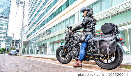 A female rider touring Yokohama on a cruiser bike A female rider touring Yokohama on a cruiser bike 103520044