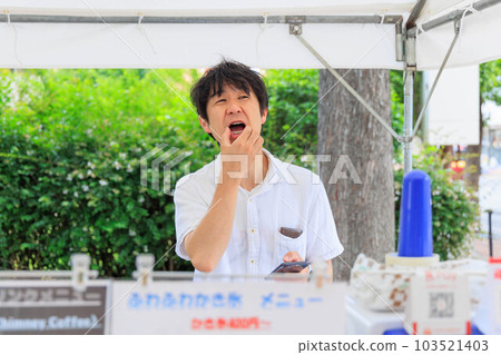 A man with a grumpy face while touching a smartphone A man with a grumpy face while touching a smartphone 103521403