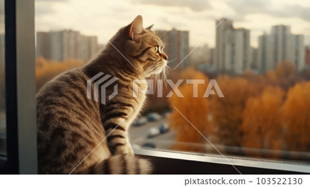 The cat sits on the windowsill in the house and watches for the fall, cold, sad mood. generated AI. 103522130