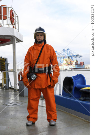 Fireman. Fire fighting equipment. Fire drill. Seaman with fire-fighters outfits and Breathing apparatus. 103522175