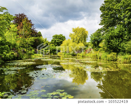 Stunning view of Monet's garden and its lily pond during summer season, Giverny, France 103522419