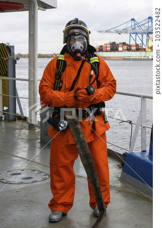 Fireman. Fire fighting equipment. Fire drill. Seaman with fire-fighters outfits and Breathing apparatus. 103522482