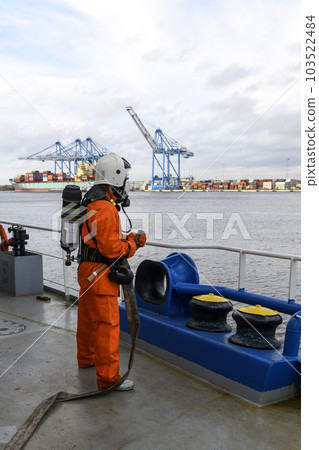 Fireman. Fire fighting equipment. Fire drill. Seaman with fire-fighters outfits and Breathing apparatus. Fireman. Fire fighting equipment. Fire drill. Seaman with fire-fighters outfits and Breathing apparatus. 103522484