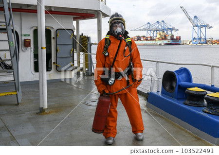 Fireman. Fire fighting equipment. Fire drill. Seaman with fire-fighters outfits and Breathing apparatus. 103522491