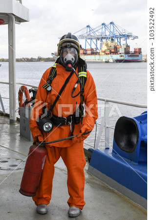 Fireman. Fire fighting equipment. Fire drill. Seaman with fire-fighters outfits and Breathing apparatus. Fireman. Fire fighting equipment. Fire drill. Seaman with fire-fighters outfits and Breathing apparatus. 103522492