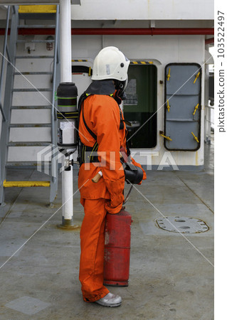 Fireman. Fire fighting equipment. Fire drill. Seaman with fire-fighters outfits and Breathing apparatus. Fireman. Fire fighting equipment. Fire drill. Seaman with fire-fighters outfits and Breathing apparatus. 103522497