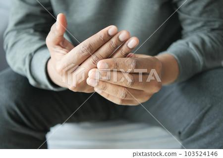 man suffering pain in hand close up  103524146
