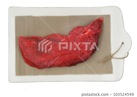 Beef pulp on a ceramic board isolated on white background. Raw meat for cooking. 103524549