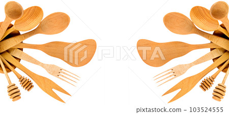 Set of wooden spoons, spatulas and forks isolated on a white . Collage. Free space for text. Wide photo. 103524555