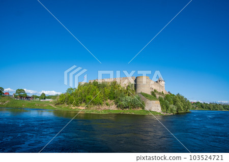 Ivangorod Fortress on the banks of the Narva River on a sunny May day 103524721