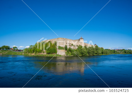 Ivangorod Fortress on the banks of the Narva River on a sunny May day 103524725