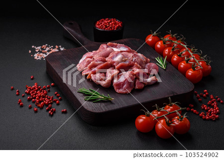 Raw chicken or turkey gizzards with salt, spices and herbs Raw chicken or turkey gizzards with salt, spices and herbs 103524902