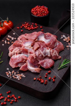 Raw chicken or turkey gizzards with salt, spices and herbs Raw chicken or turkey gizzards with salt, spices and herbs 103524910