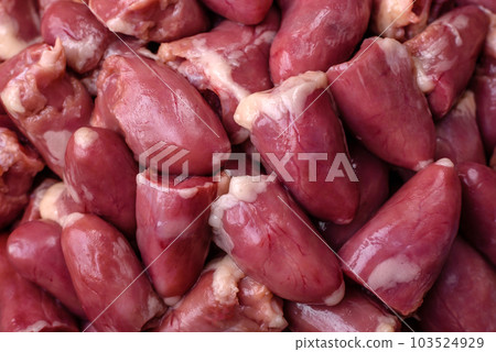 Raw chicken or turkey hearts with salt, spices and herbs Raw chicken or turkey hearts with salt, spices and herbs 103524929
