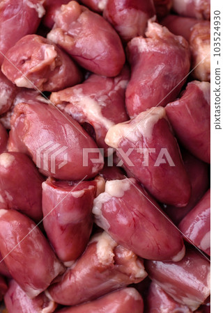 Raw chicken or turkey hearts with salt, spices and herbs 103524930