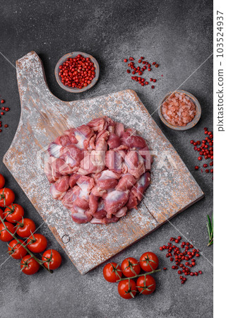 Raw chicken or turkey gizzards with salt, spices and herbs Raw chicken or turkey gizzards with salt, spices and herbs 103524937