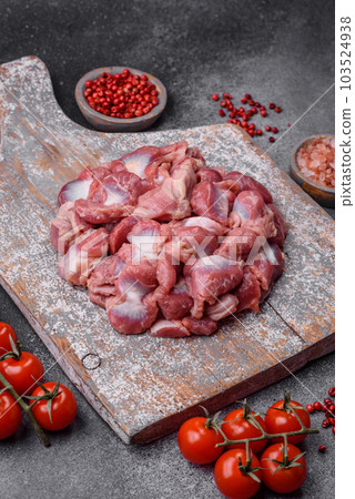 Raw chicken or turkey gizzards with salt, spices and herbs Raw chicken or turkey gizzards with salt, spices and herbs 103524938