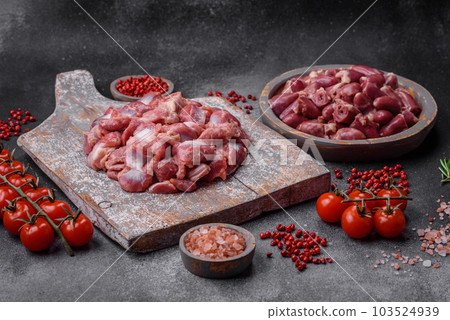 Raw chicken or turkey gizzards with salt, spices and herbs Raw chicken or turkey gizzards with salt, spices and herbs 103524939