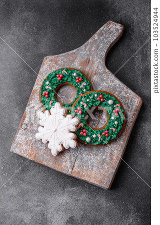 Delicious beautiful Christmas gingerbread cookies on a textured concrete background 103524944