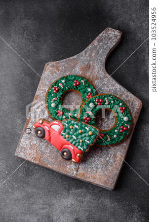Delicious beautiful Christmas gingerbread cookies on a textured concrete background 103524956