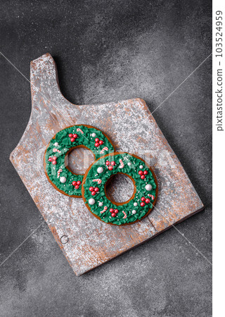 Delicious beautiful Christmas gingerbread cookies on a textured concrete background Delicious beautiful Christmas gingerbread cookies on a textured concrete background 103524959