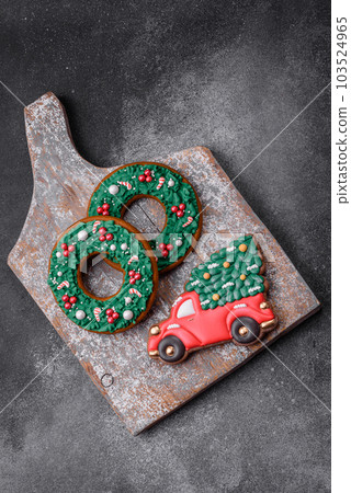 Delicious beautiful Christmas gingerbread cookies on a textured concrete background 103524965