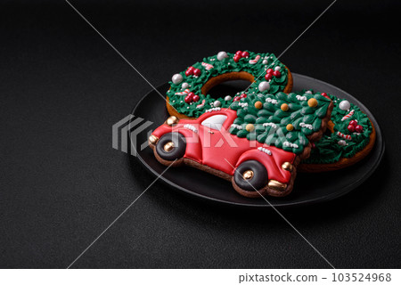 Delicious beautiful Christmas gingerbread cookies on a textured concrete background 103524968