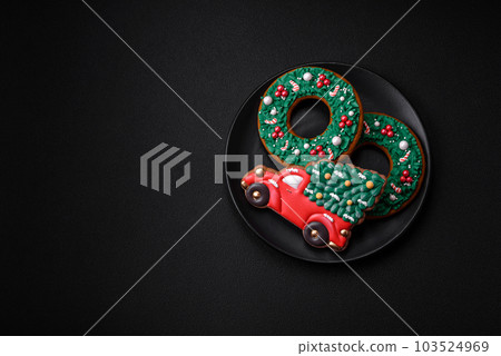 Delicious beautiful Christmas gingerbread cookies on a textured concrete background Delicious beautiful Christmas gingerbread cookies on a textured concrete background 103524969