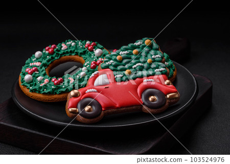 Delicious beautiful Christmas gingerbread cookies on a textured concrete background 103524976